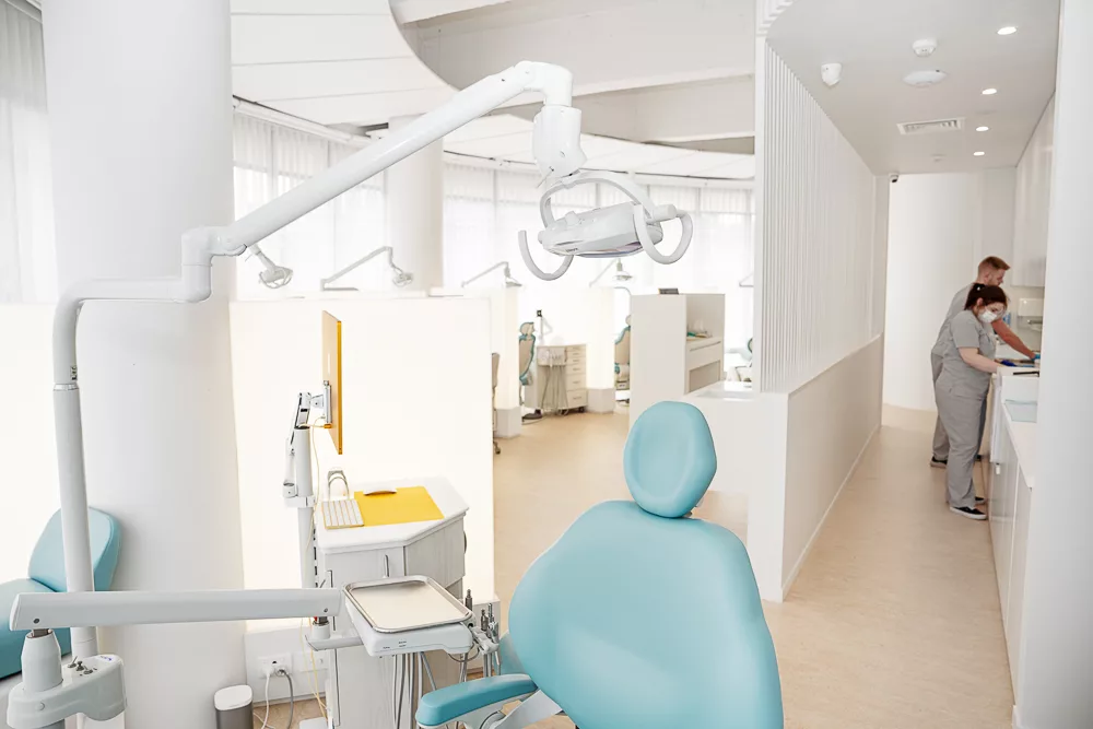 Milk Orthodontics team members preparing a treatment bay in the Newmarket clinic