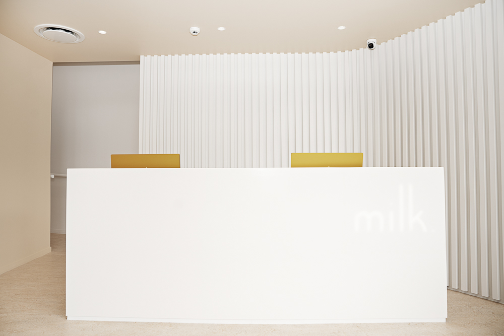 Front desk with the milk logo at the award-winning Milk Orthodontics clinic in Newmarket