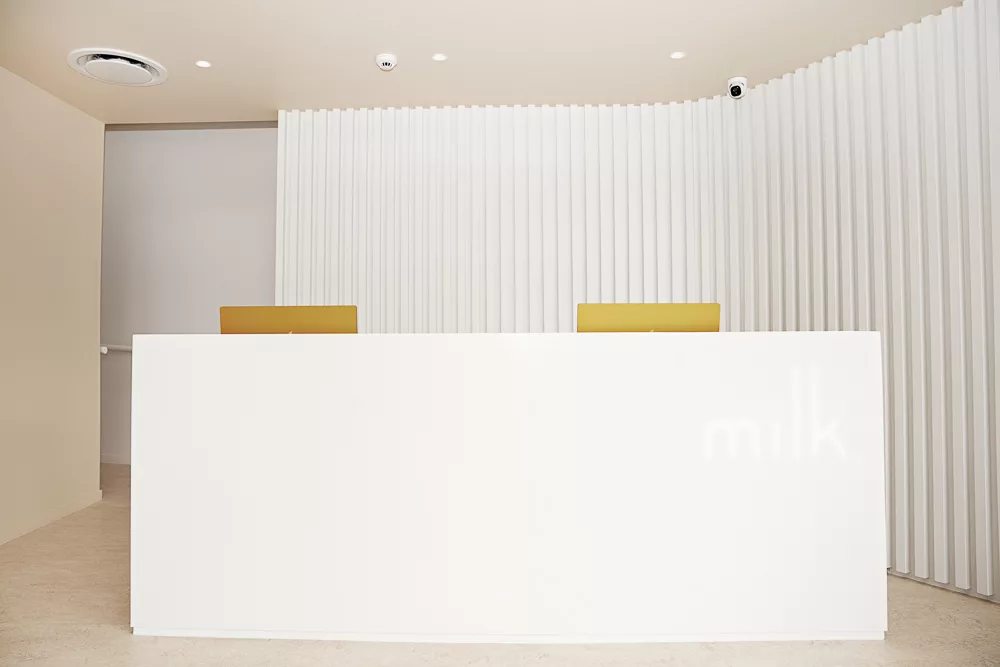 Front desk with the milk logo at the award-winning Milk Orthodontics clinic in Newmarket