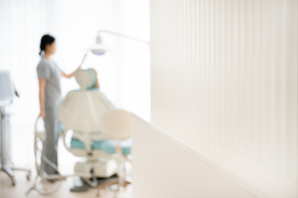 A Milk Orthodontics clinician preparing a treatment light