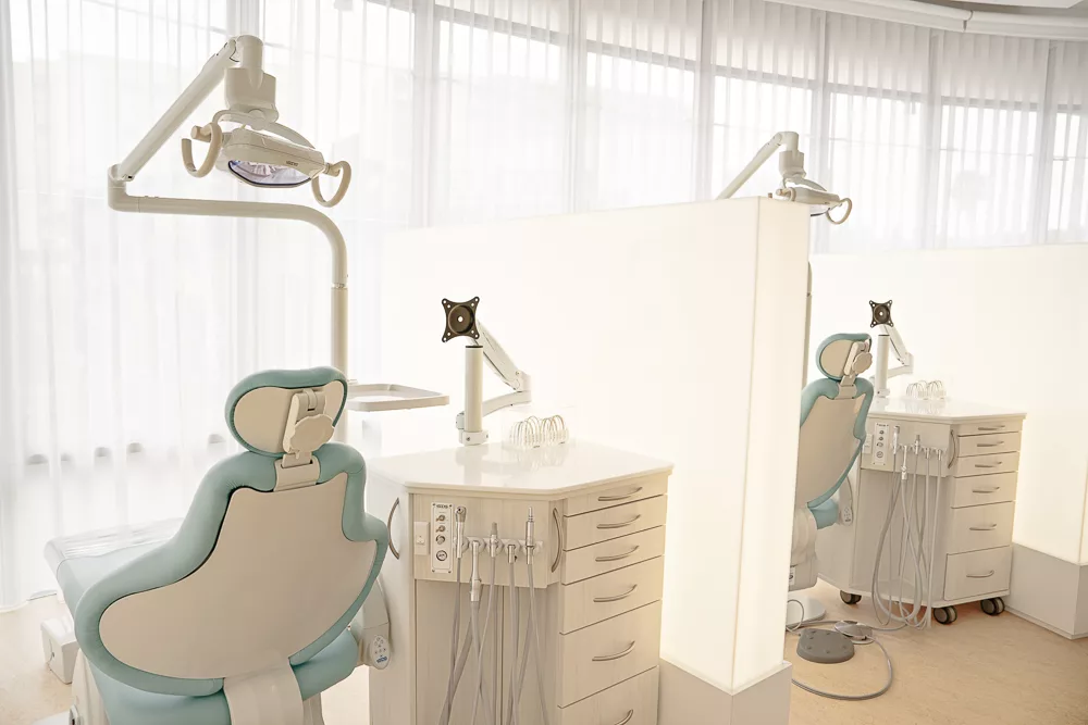 Treatment bay with a pale blue chair and equipment at Milk Orthodontics Newmarket